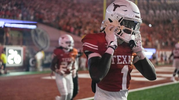 Xavier Worthy jogs off of the field at DKR